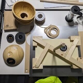 Workbench with wooden bowl, speaker drivers and laser-cut rings