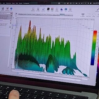 Laptop showing a 3D waterfall spectrogram of frequency response
